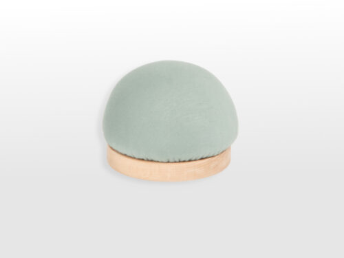 Side view of oval form on wooden base