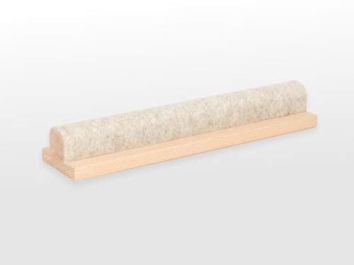 Angled view of wool covered bar on a wooden base