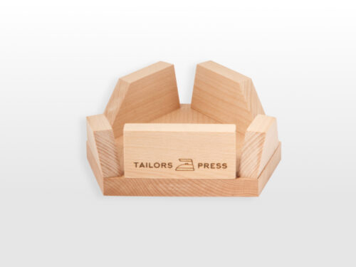 Face view of wooden ham cradle with engraved tailors press logo