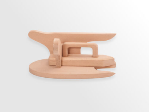 Wooden tool with many panels and curves, flat edge & points. Separating clapper nestled in tool