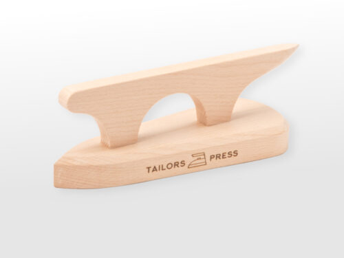 Angled view of wooden iron shaped tool with shaped and point handle