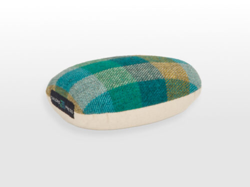 Profile view of small regular ham with green checked ham ontop with tailors press logo label and cotton base
